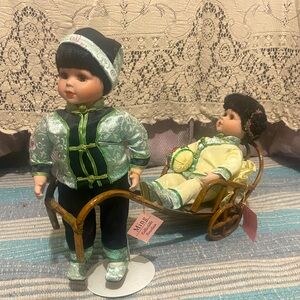 Vintage Asian street taxi porcelain dolls